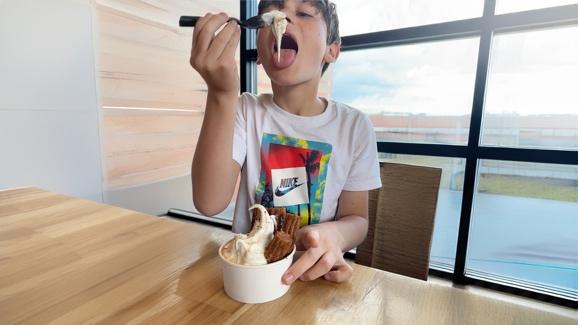 Boy eating Churro Sundae